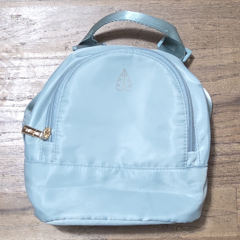 NWOT Biossance Light Teal Mini Backpack
